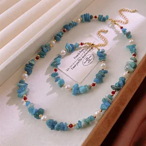 Aquamarine and pearl jewelry set with necklace and bracelet in vintage gold finish