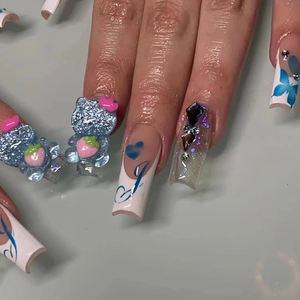 Blue 3D cat press-on nails with butterfly prints and heart charms in a French tip style.