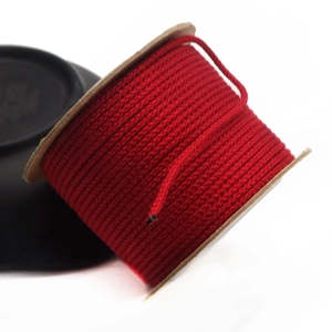 Detail of red 1.5mm cotton cord spool for DIY jewelry making and beading projects