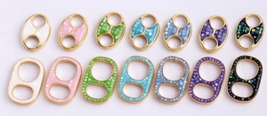 Detailed grid of colorful enamel clover pull-tab jewelry connectors for DIY bracelets