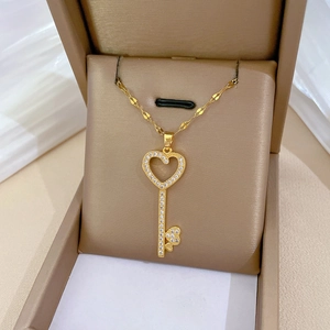 Elegant gold titanium heart key pendant necklace with crystals in jewelry box