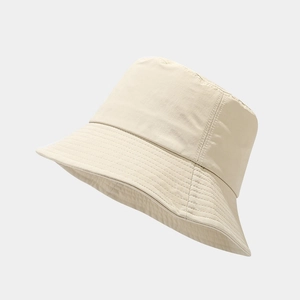 Classic cream white bucket hat in a 45-degree angle view with multi-row stitched brim
