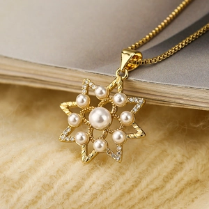 Elegant gold box chain necklace with star pendant featuring pearls and zircon accents