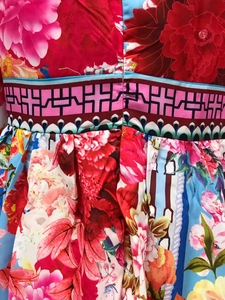 Close-up of vibrant floral print and seam craftsmanship on lightweight maxi dress