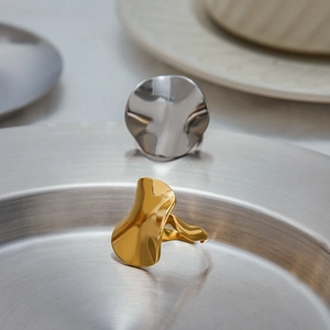 Polished wavy irregular stainless steel rings in gold and silver mirror finish