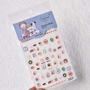 Detailed macro view of thin-cut cartoon nail stickers featuring bears and sweets
