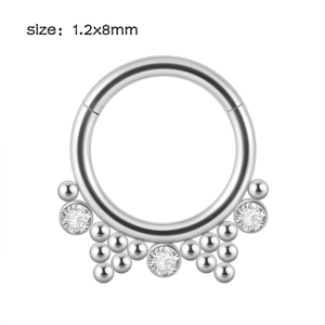 Detailed macro view of silver stainless steel septum clicker ring with 1.2x8mm sizing