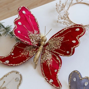 Velvet Christmas butterfly clip with gold sequins and red gems for festive tree decoration