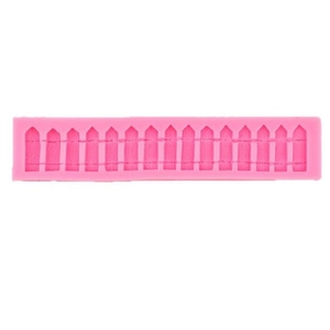 Pink silicone mold featuring a detailed wood grain garden fence design for fondant baking