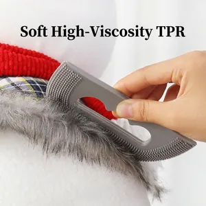 Gray handheld TPR pet hair remover with dual serrated brush head for cleaning fur