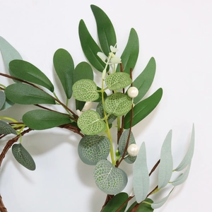 Detail of 30cm faux eucalyptus willow ring with white berries and textured green leaves