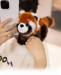 Close-up of fluffy red panda plush bag showing spacious interior and soft faux fur texture