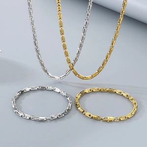 Parure pour homme en acier titane avec colliers et bracelets à maillons en U or et argent