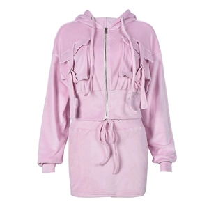 Detailed texture of pink velvet two-piece set featuring cropped hoodie and mini skirt