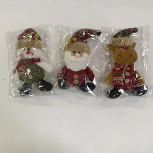 Three plush Christmas figurines of Santa, Snowman, and Reindeer in plastic bags