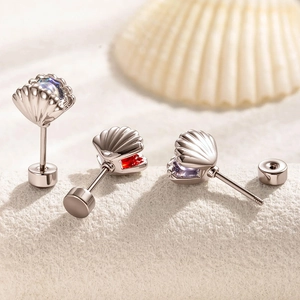 Titanium steel shell stud earrings with colorful blue, red, and purple gemstones