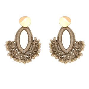 Close-up of bohemian fan-shaped beaded earrings with brown thread weave and golden studs