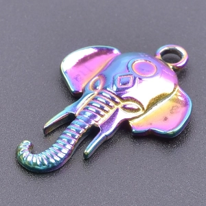 Macro shot of stainless steel elephant pendant with rainbow plating and fine textures