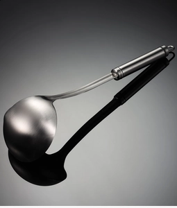 Close-up of a 304 stainless steel oil separator spoon with a hanging hole design