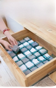 Blue honeycomb drawer divider for socks showing flexible and modular organization