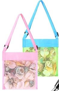 Detail of two mesh beach bags in pink and cyan with adjustable straps for shells