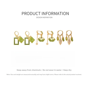 Detailed view of gold leaf earrings with green stones and dimensions in centimeters