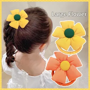 Cute fabric flower hair ties for girls featuring soft elastic scrunchies in bright colors