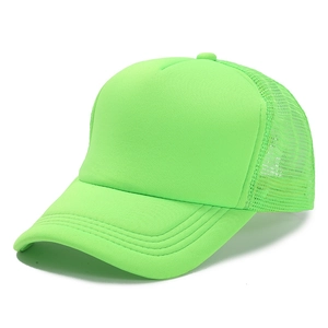 Detail view of neon green trucker hat showing foam front panel and breathable mesh back