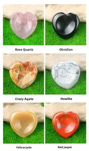 Macro detail of heart-shaped crystal bowls crafted from various natural gemstones