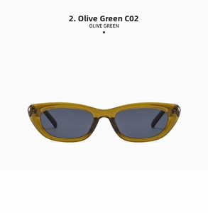 Detail view of olive green cat eye sunglasses with metal hinges and translucent frames