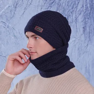 Winter knitted hat and neck gaiter set with fleece lining and leather label detail