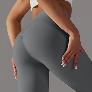 Close-up of high-waist yoga pants in dark grey featuring reinforced flat seams