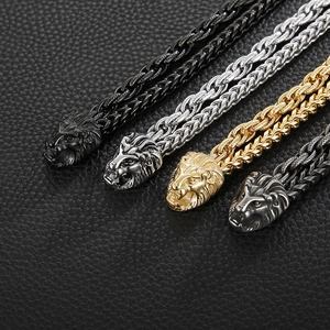 Men's bold lion head bracelets in black, gold, and silver finishes with woven chain straps