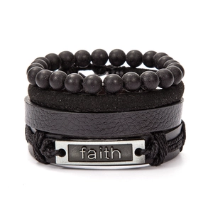 Detail view of black layered leather bracelet with faith engraved metal plate and beads
