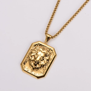 Macro view of golden stainless steel square pendant with embossed lion head and box chain
