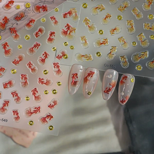 Detail of 3D embossed koi fish nail stickers with gold powder and colorful textures