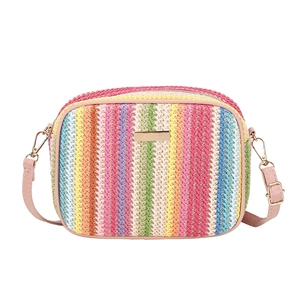 Rainbow striped woven crossbody bag with pink leather strap and gold hardware accents