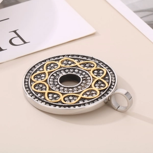 Detailed shot of infinity symbol pendant with silver rhinestones and gold accents
