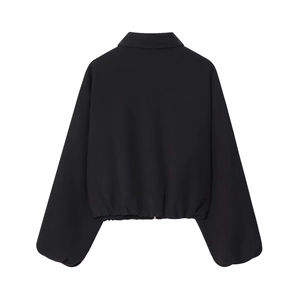 Back view of a black long-sleeve zip jacket featuring a chic collar and puffed hemline