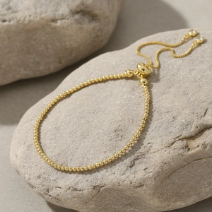 Minimalist 18K gold-plated beaded bolo bracelet with adjustable sliding zircon pendants