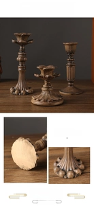 Detail of vintage lotus candle holders with intricate antique finish and classic carvings