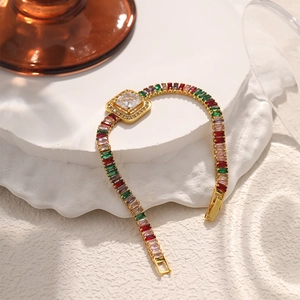 Vintage gold bracelet featuring colorful square zircons on a white marble texture base