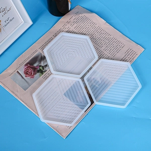 Three-piece set of hexagonal silicone molds with geometric striped textures for resin coasters