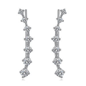 Macro shot of curved silver crawler earrings featuring seven sparkling round cut zircons