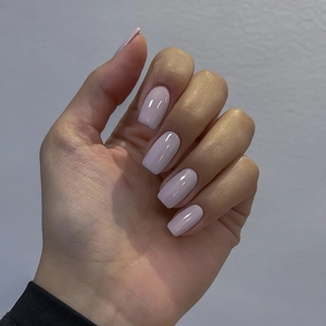Glossy light purple long square press-on nails on hands with a smooth high-shine finish