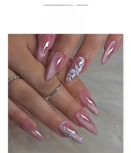 Detail of almond cat-eye press-on nails with floral art and velvet shimmer finish