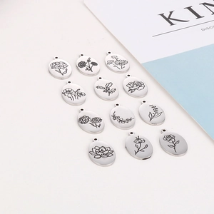 Lot de 12 pendentifs ovales fleurs de naissance en acier inox avec gravures florales
