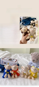 Close-up of cute 3D plush bear dolls attached to cotton socks in various colors