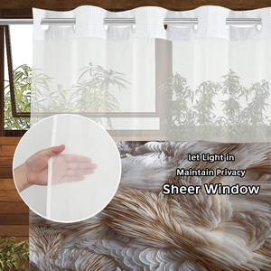 Detailed view of white sheer window curtain showing breathable fabric and light filtering
