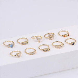 Set of 10 gold 18K plated nose rings with colorful zircon inlays and geometric shapes